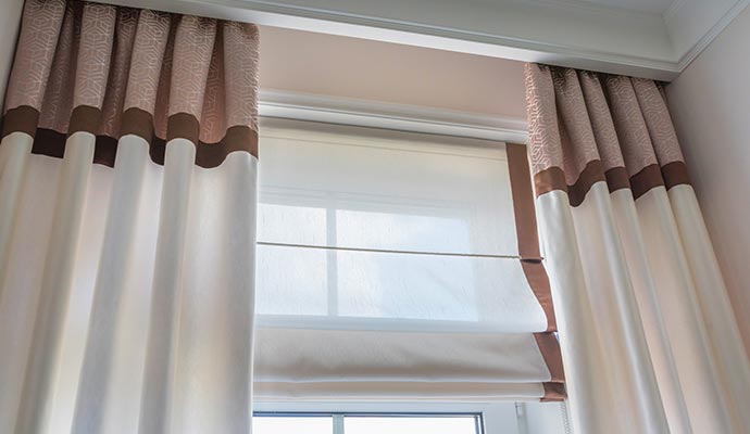 Elegant silk draperies hanging in window